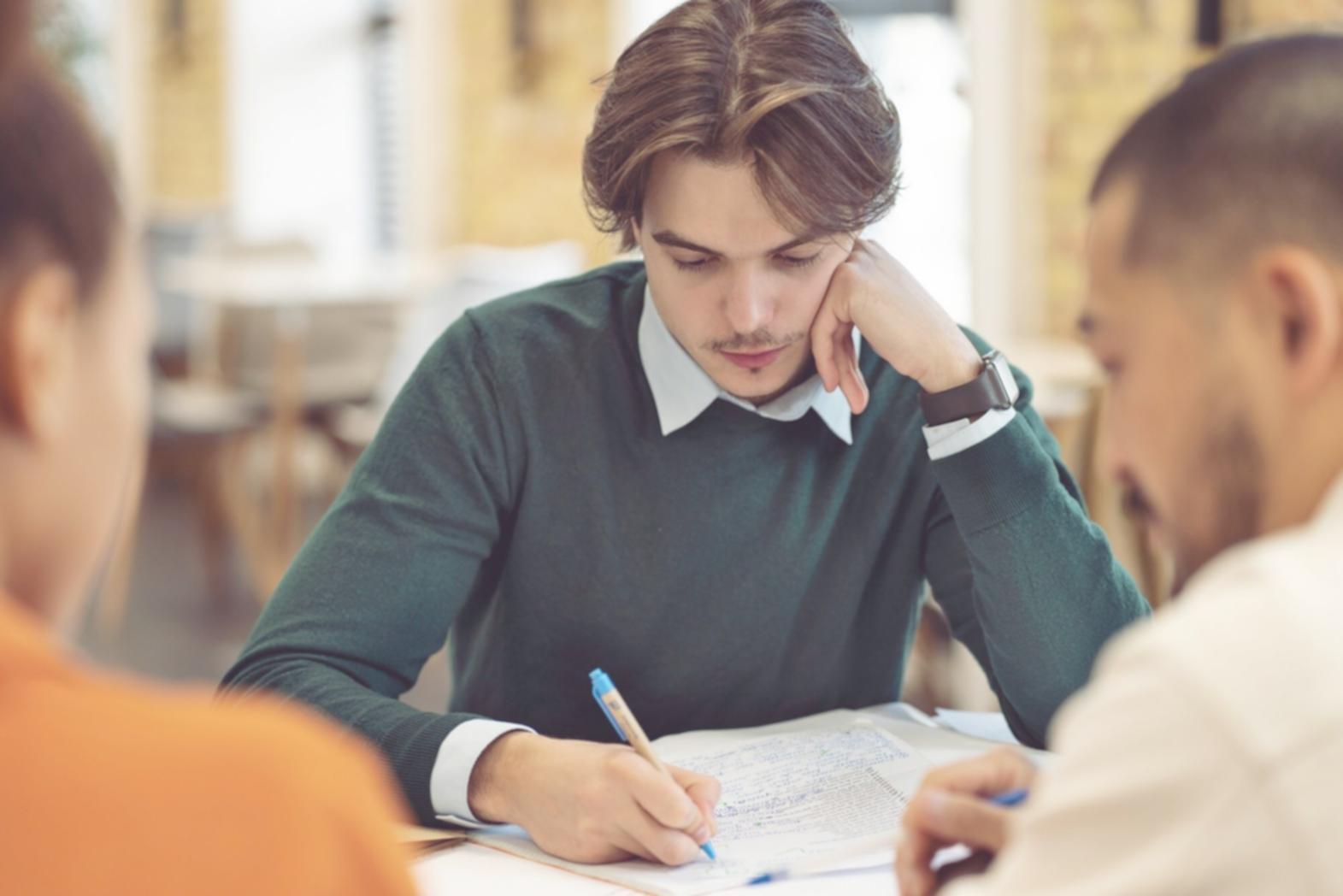 Network technician configuring enterprise routing equipment in modern data center